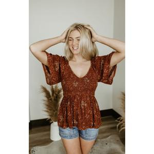 Womans Floral Flutter Sleeve Smocked Peplum Top